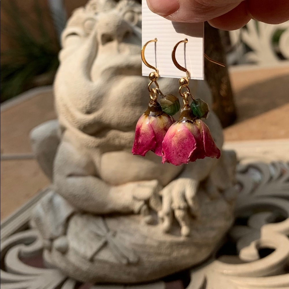 Real pink rosebuds dangle from your ears!